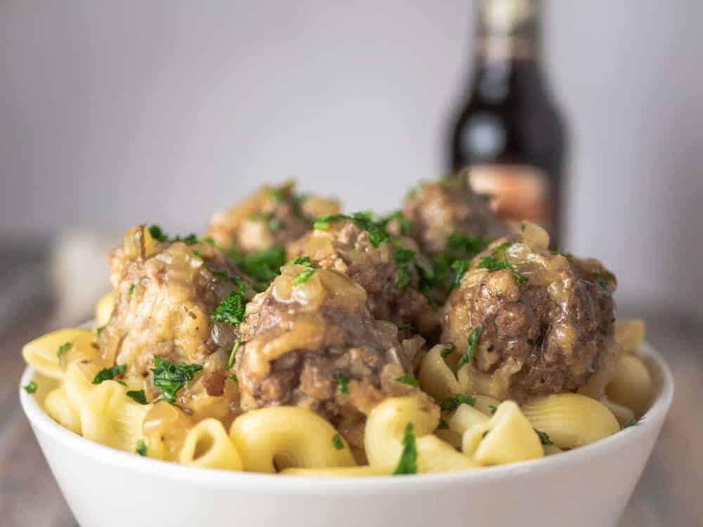 Big juicy salisbury meatballs with gravy over pasta