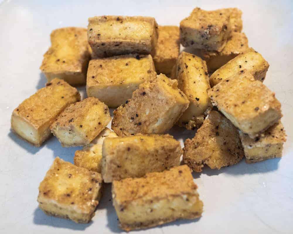 baked tofu close up before stir frying showing crunchy texture