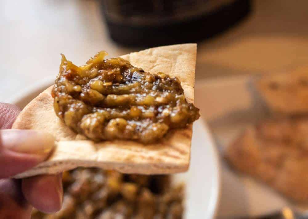 roasted eggplant dip on pita bread close up