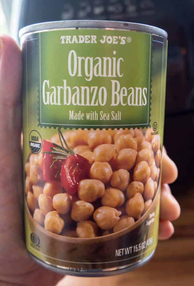 Organic chickpeas from trader joes being held in hand.