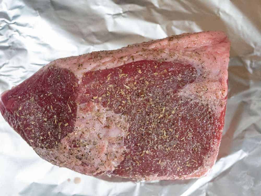 raw uncooked eye of round beef roast