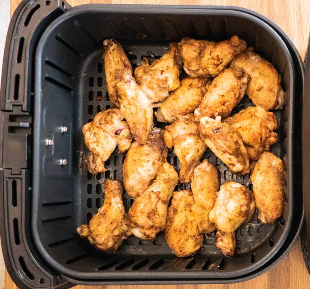 crispy done jerk wings in the air fryer basket