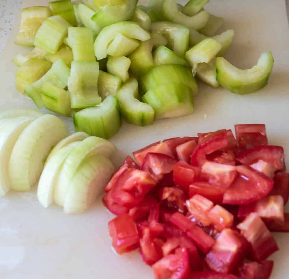 Chopped cucumbers, tomato, and onion