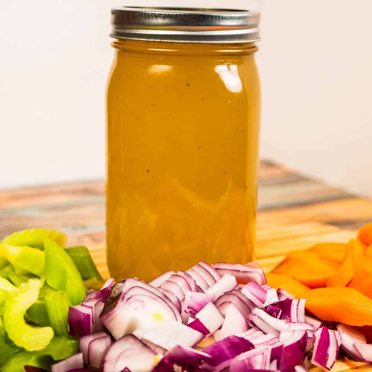 Instant Pot Vegetable Stock homemade with a bunch of veggies and herbs