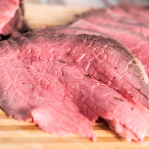 Thin sliced roast beef frontal picture.