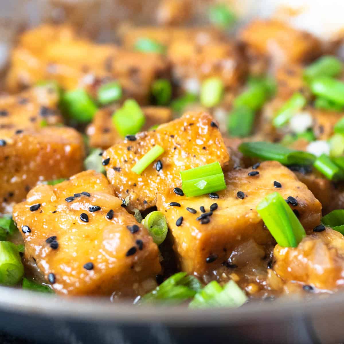 ginger garlic tofu stir fry in the pan close up image