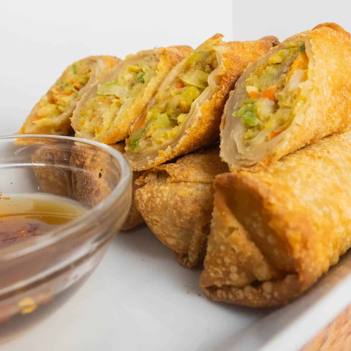 Crunchy up close shot of frozen egg rolls that were cooked in the air fryer.