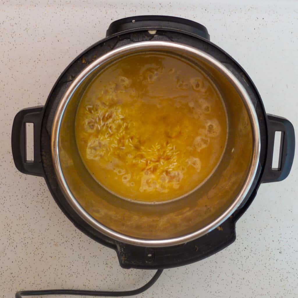 Above view of instant pot open with spices stirred in