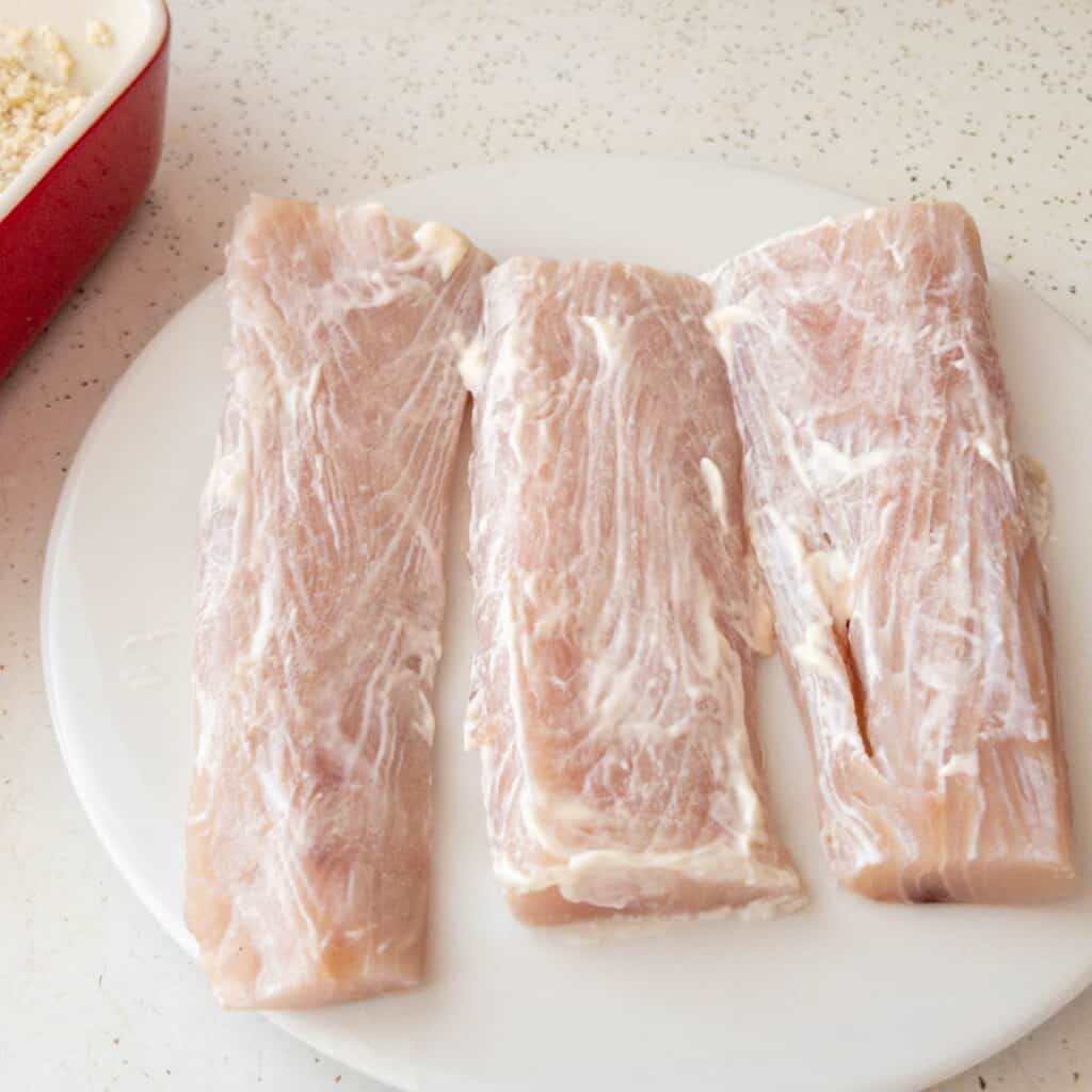 air fryer mahi mahi cooking step 1 - Coat filets with mayonaise