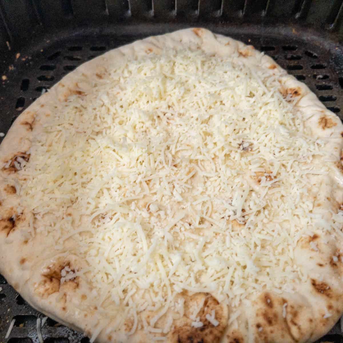 naan pizza in the air fryer cooking step 2