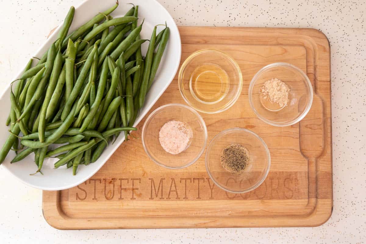  ingredients on board with salt,pepper,garlic powder and olive oil.