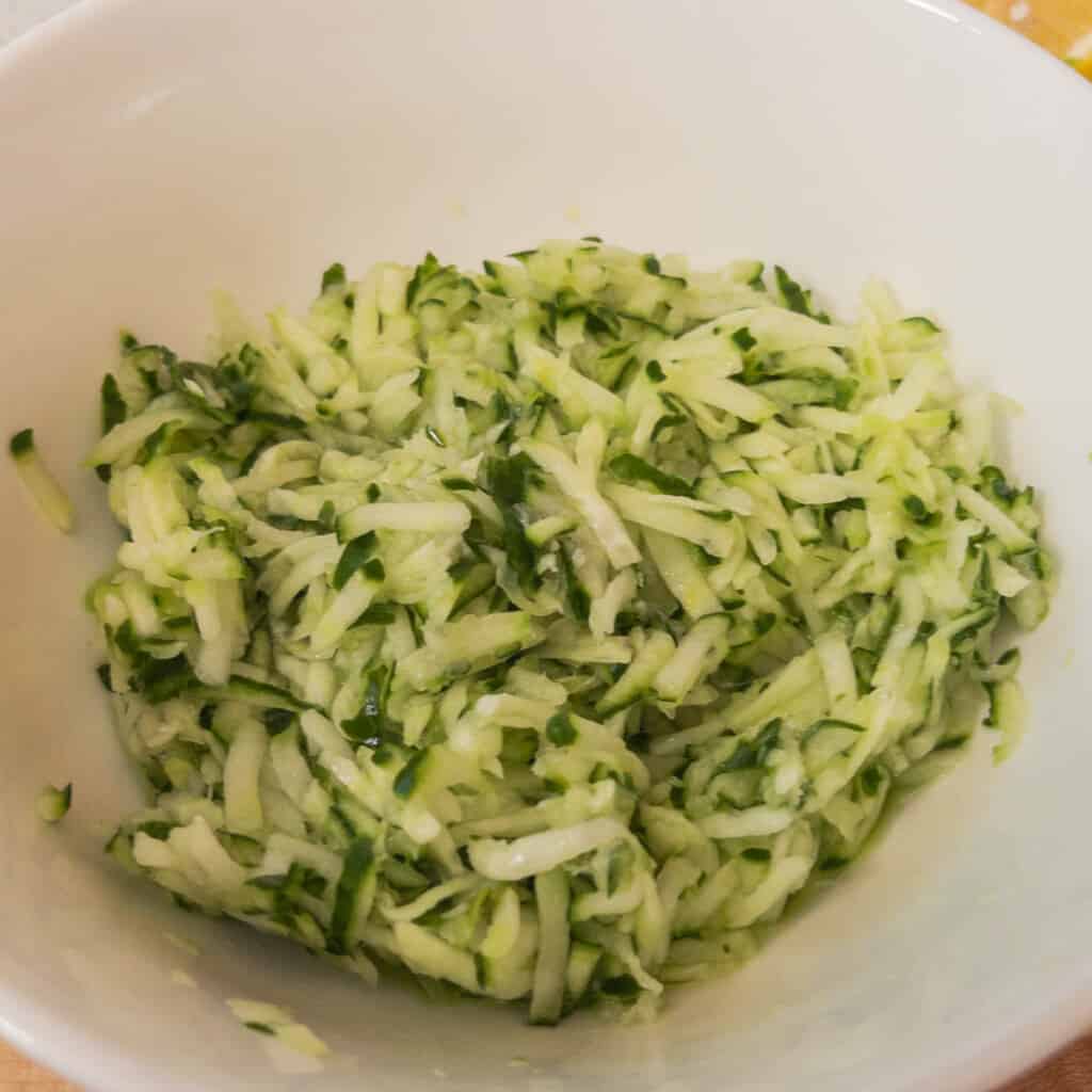 Step 1 Grate the cucumber using a food processor or standard grater