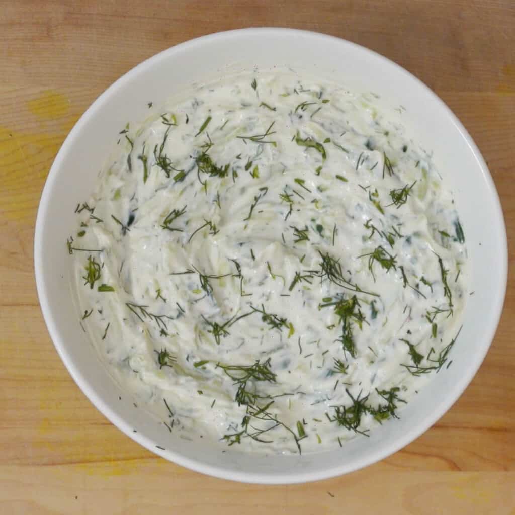 Step 4 mix all ingredients in a bowl and top tzatziki sauce with dill