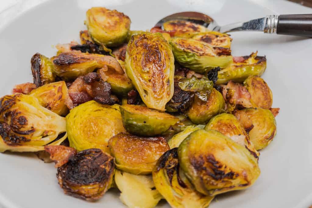 golden charred roasted brussel sprouts in a bowl