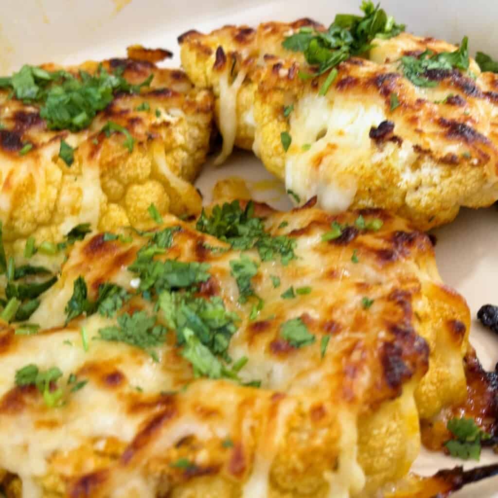 closeup of cheesy cauliflower steaks