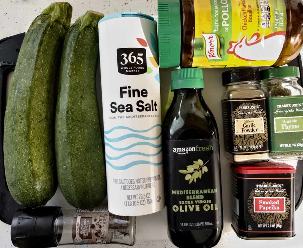 ingredients for air fryer zucchini spread out on cutting board