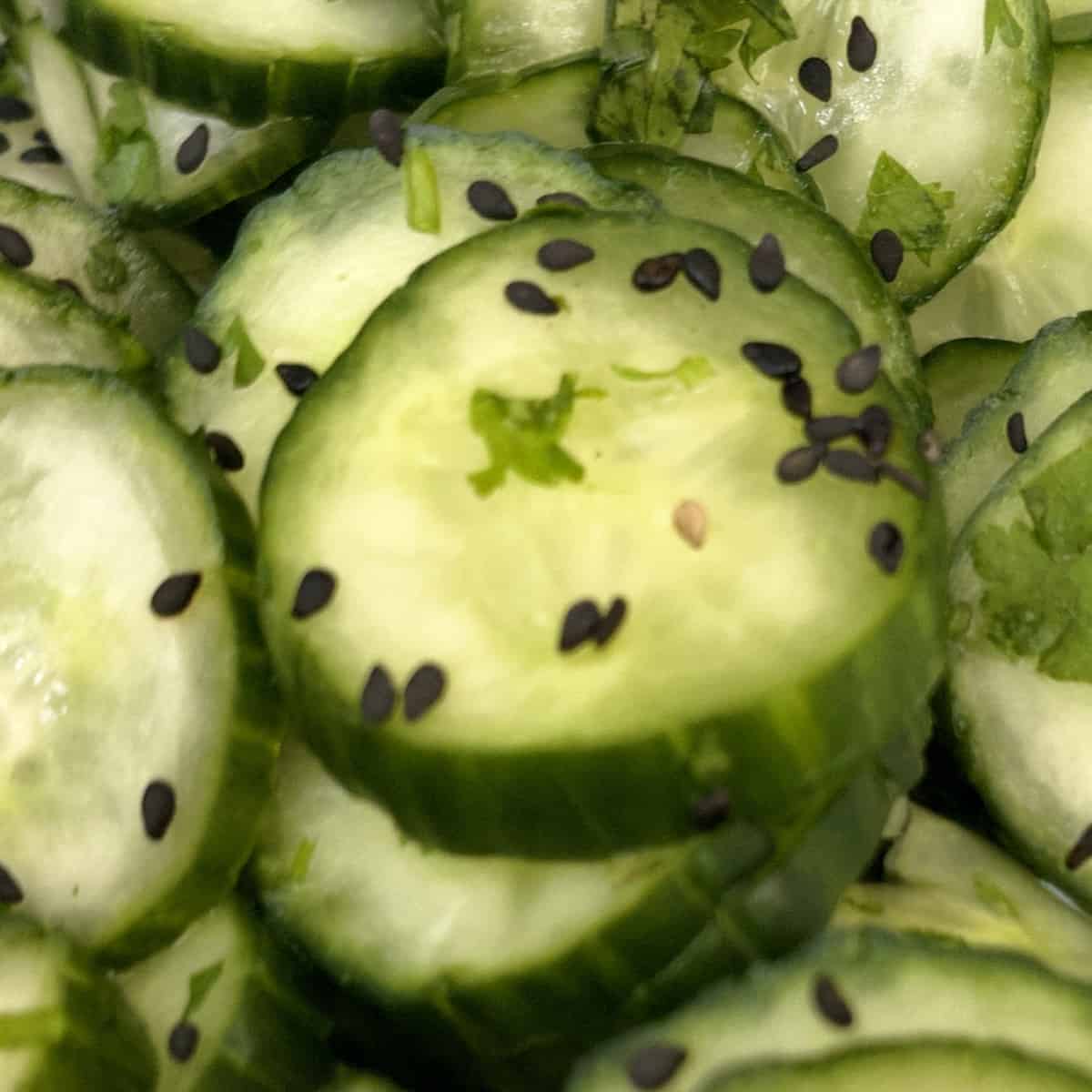featured photo of asian cucumber salad close up in a bowl.