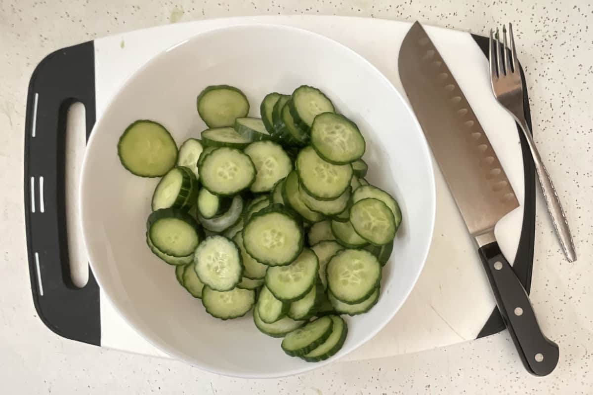 cucumbers cut up in a bowl waiting to be salted.