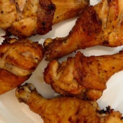 featured close up of black pepper garlic chicken legs cooked in the air fryer