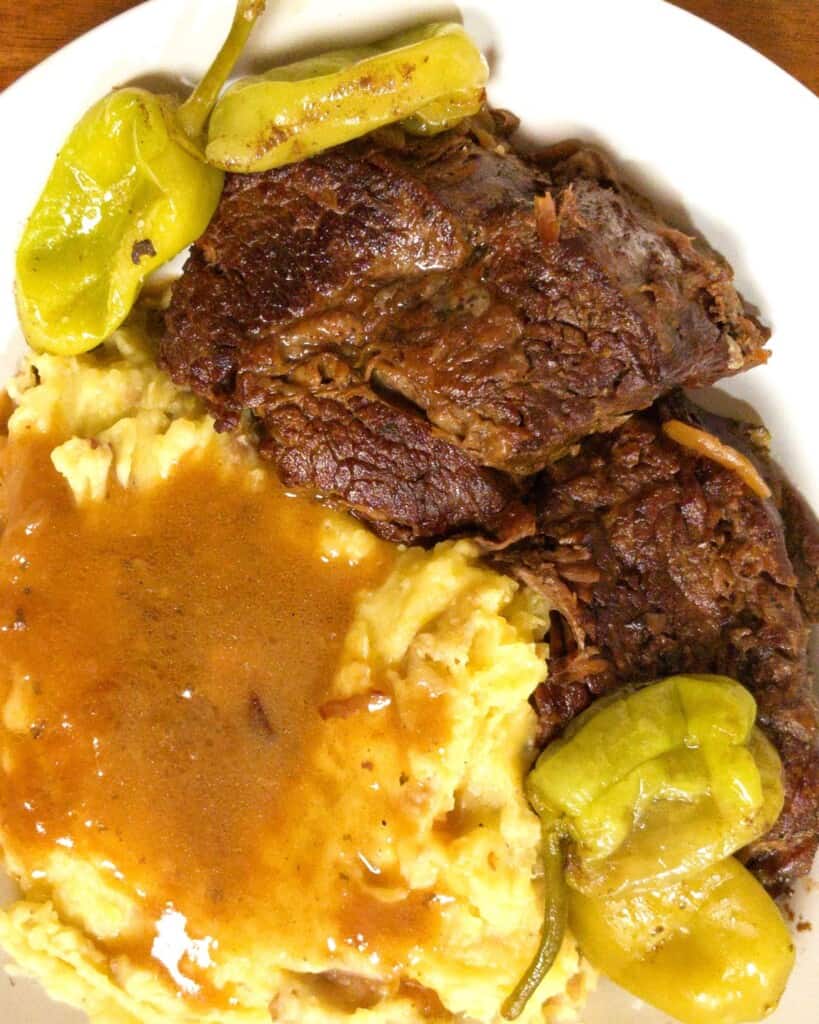 Mississippi pot roast with pepperonis mashed potatoes and gravy.