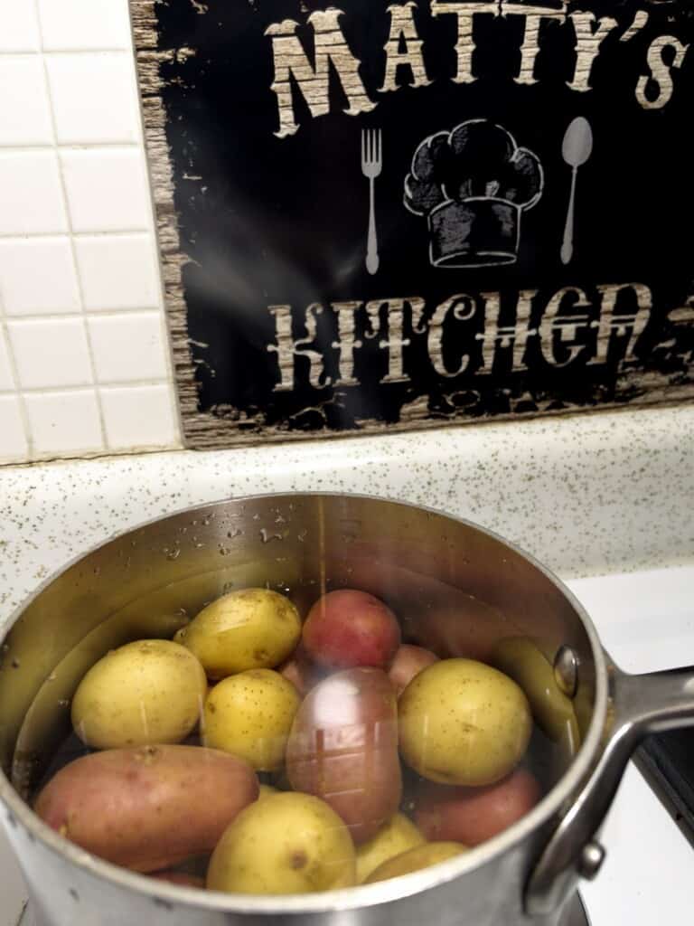 mini new potatoes in a pot of boiling water for mashed potatoes.