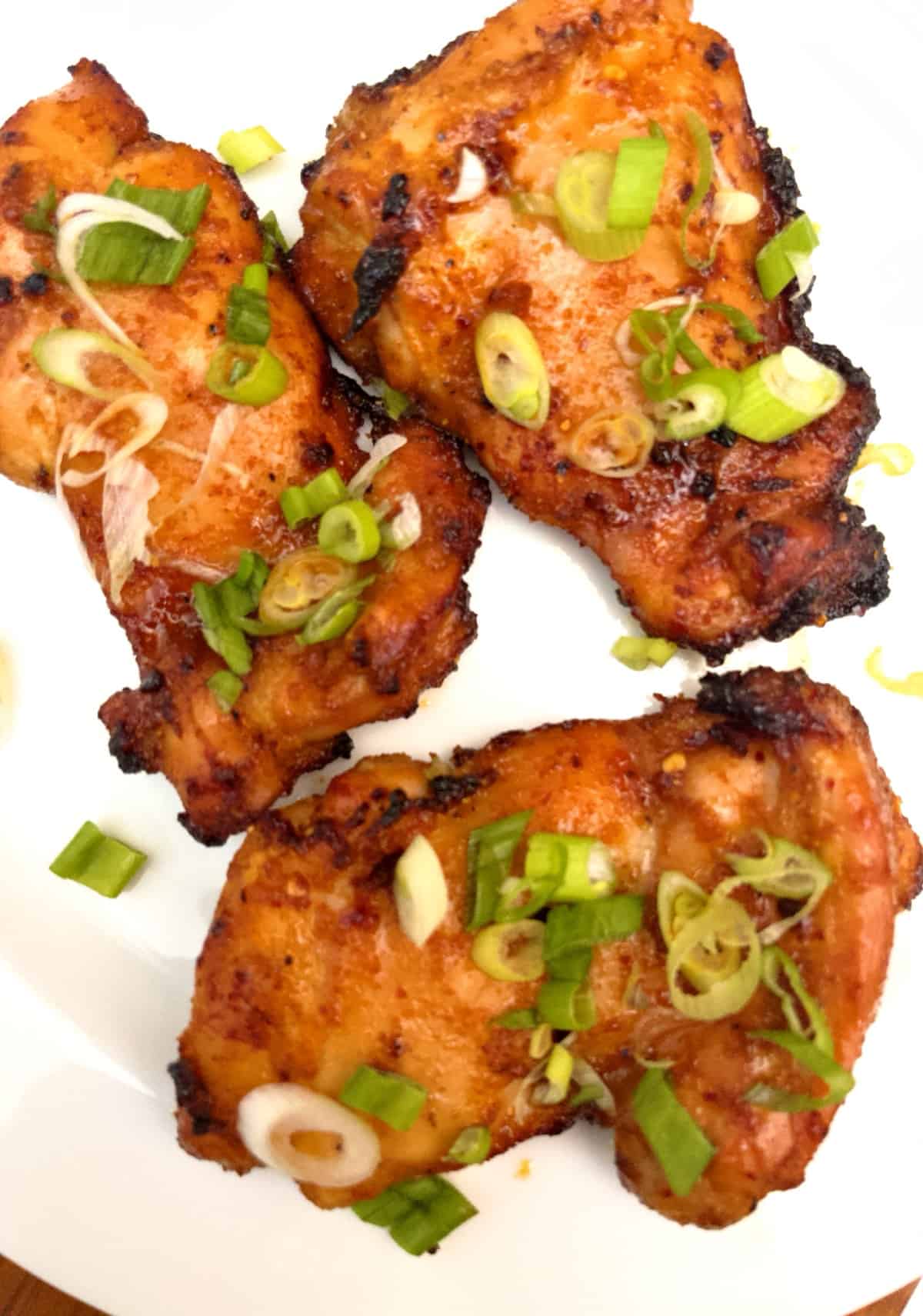 boneless chicken thighs on plate cooked in air fryer