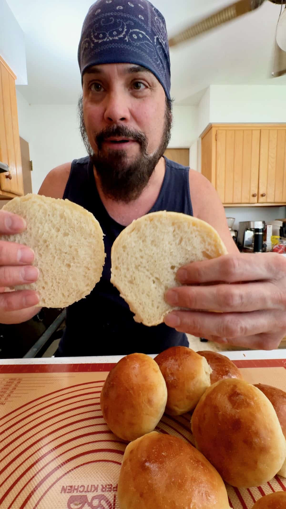 Soft homemade sandwich roll showing the fluffy interior
