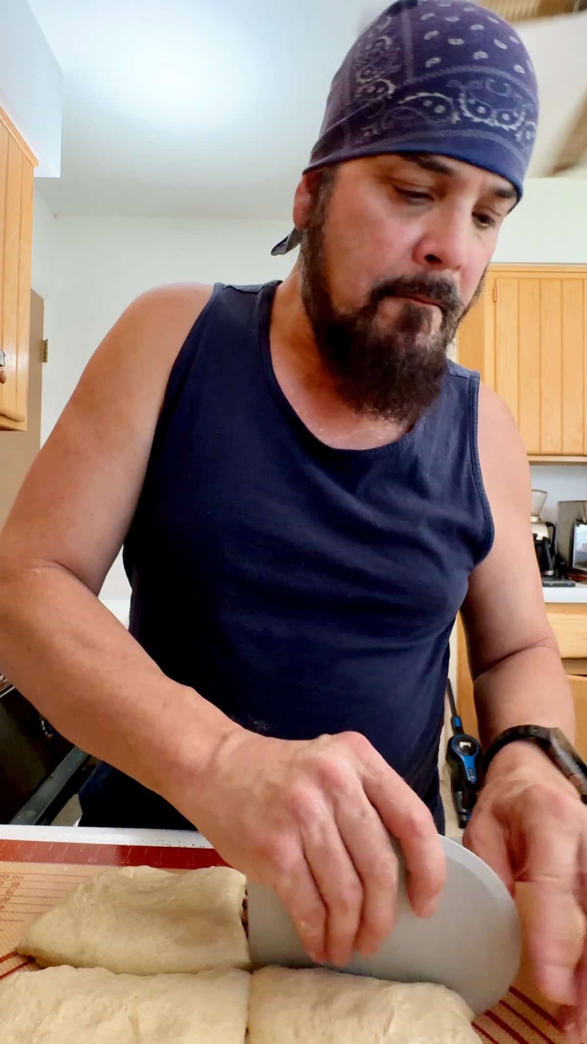 Dividing sandwich roll dough into equal pieces
