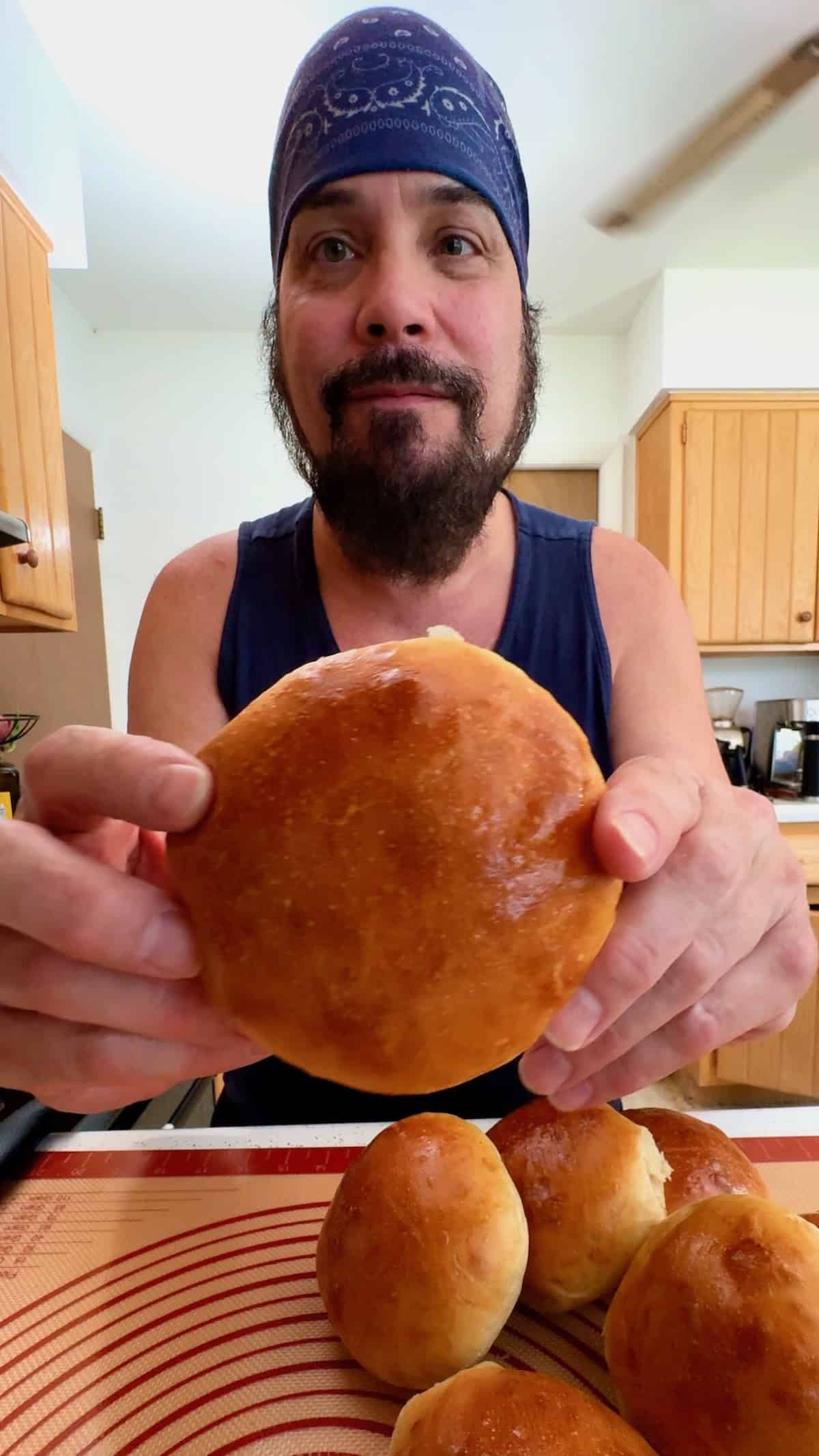 Matty holding a homemade sandwich roll