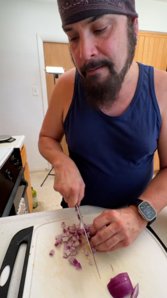 Finely dicing red onion for Shirazi salad